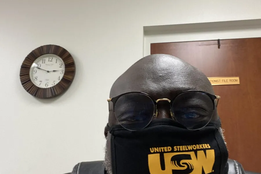usw_-_local_8888_-_photo_-_spivey_-_usw_mask_with_clock.jpg