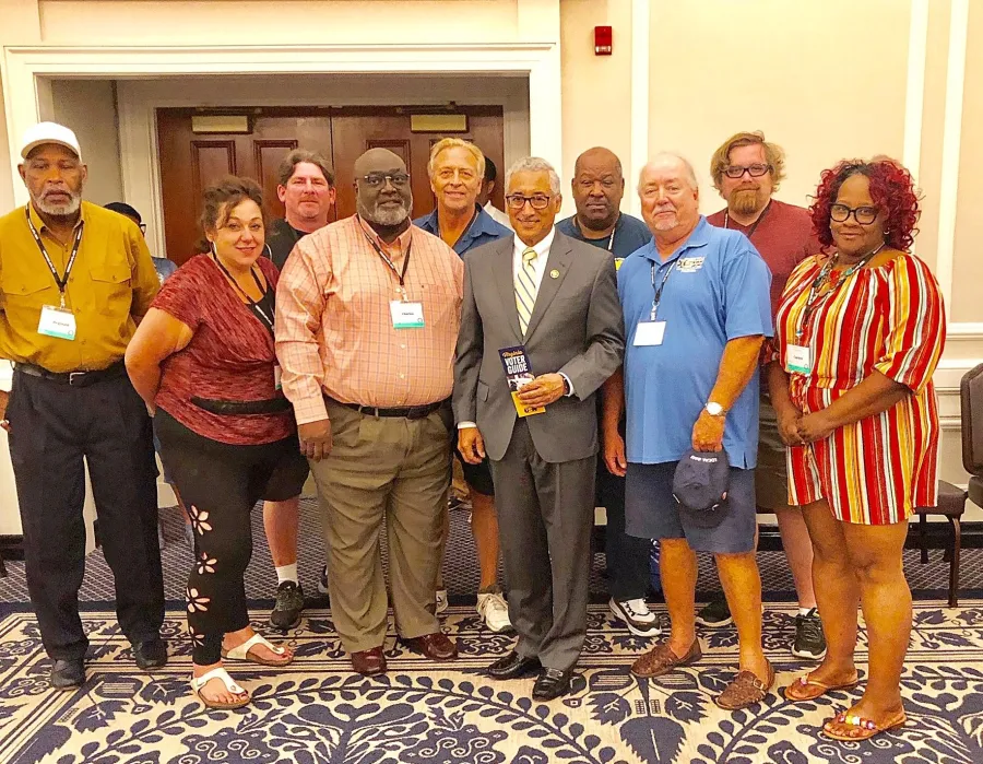 usw_-_local_8888_-_photo_-_bobby_scott_with_brochure.jpg