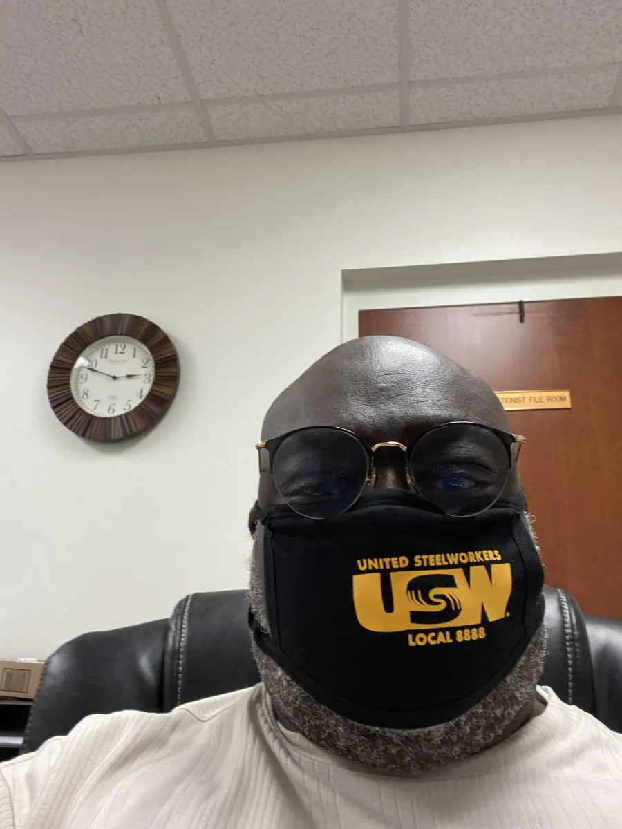 usw_-_local_8888_-_photo_-_spivey_-_usw_mask_with_clock.jpg